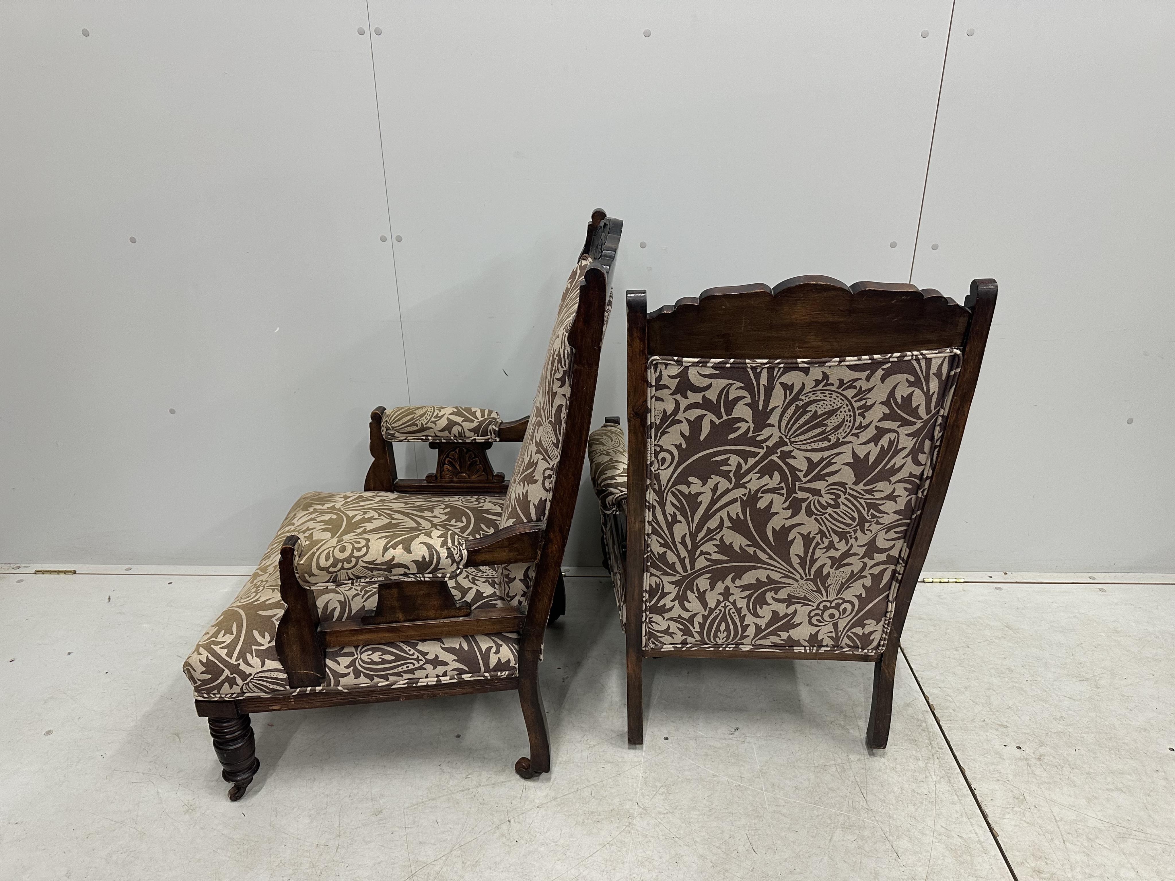 A pair of Victorian mahogany upholstered open armchairs, width 56cm, depth 62cm, height 101cm. Condition - fair